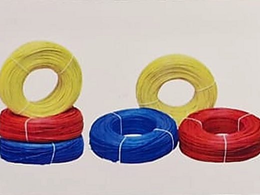 Coils of house wiring cable in yellow, red and blue