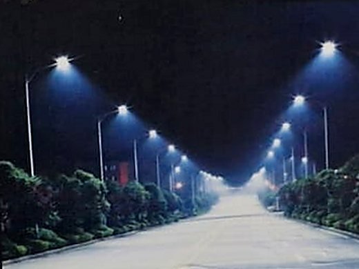A residential street lit at night