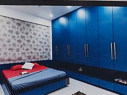 A fitted bedroom wardrobe in blue